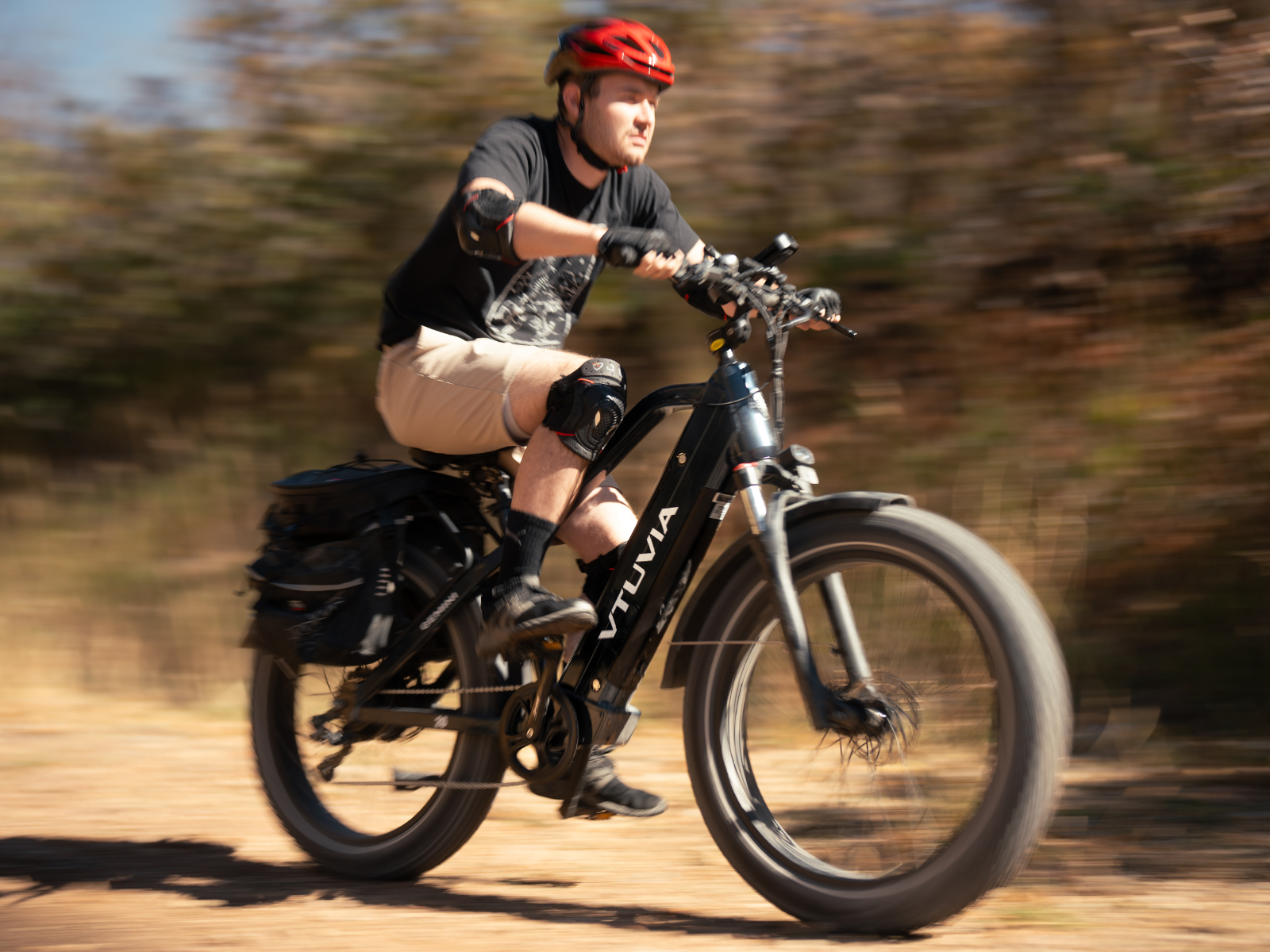 Gemini Electric Bike Riding Fast Outdoors With Rider Wearing Safety Gear | VTUVIA GEMINI