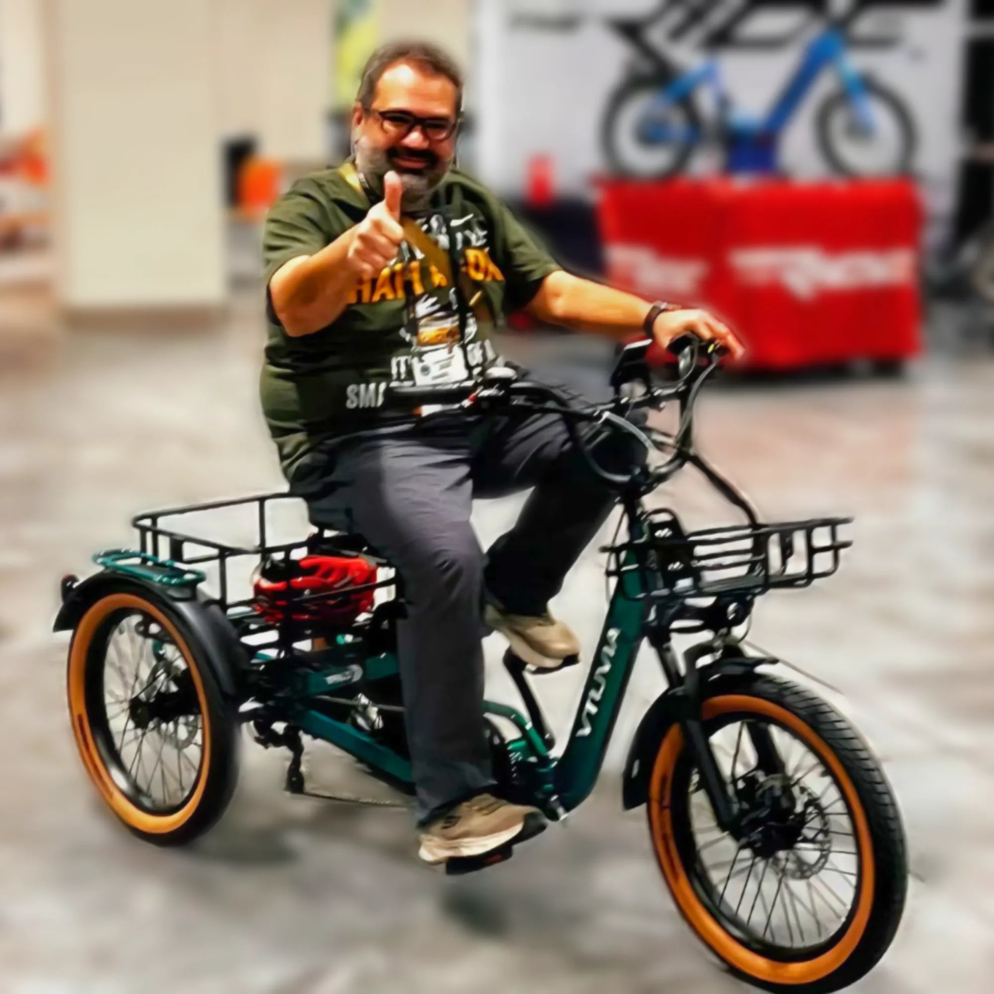 VTUVIA E-COZY electric trike rider riding outdoors with rear basket and three-wheel stability
