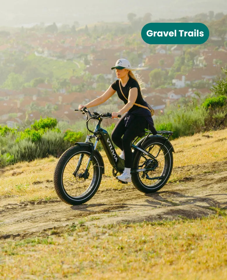 VTUVIA Reindeer 2.0 fat tire electric bike riding on gravel trail, all-terrain capability