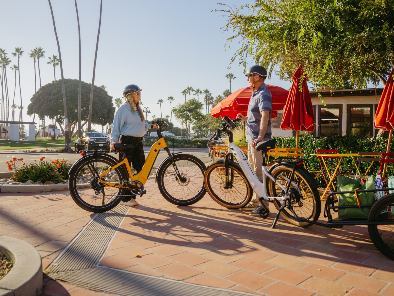Two seniors riding VTUVIA Zeal LT7 electric bikes together outdoors